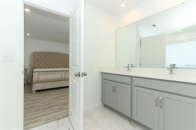 bathroom featuring vanity and wood-type flooring