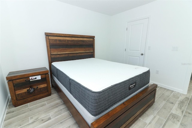 bedroom with light hardwood / wood-style flooring