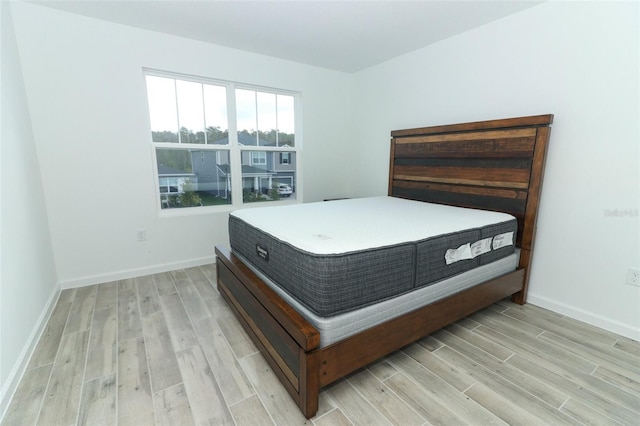 bedroom with light hardwood / wood-style flooring