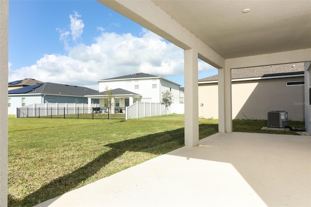 view of yard featuring central AC unit and a patio