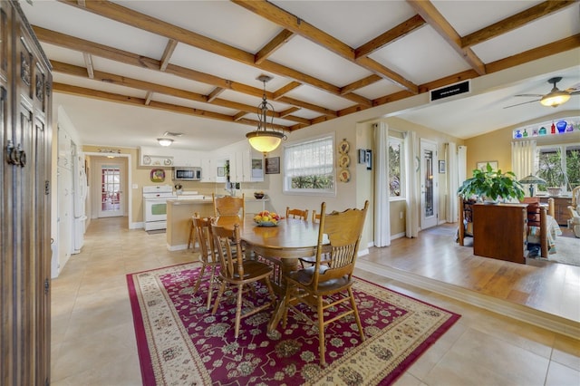 tiled dining space featuring beamed ceiling, ceiling fan, a healthy amount of sunlight, and coffered ceiling