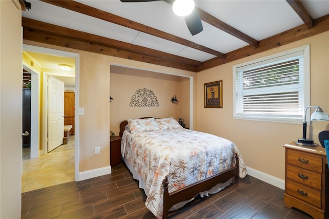 bedroom with beamed ceiling, ensuite bathroom, and ceiling fan