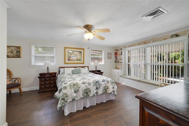 bedroom featuring ceiling fan and dark wood-type flooring