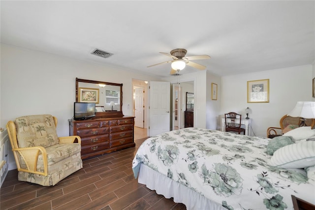 bedroom with ceiling fan and dark hardwood / wood-style flooring