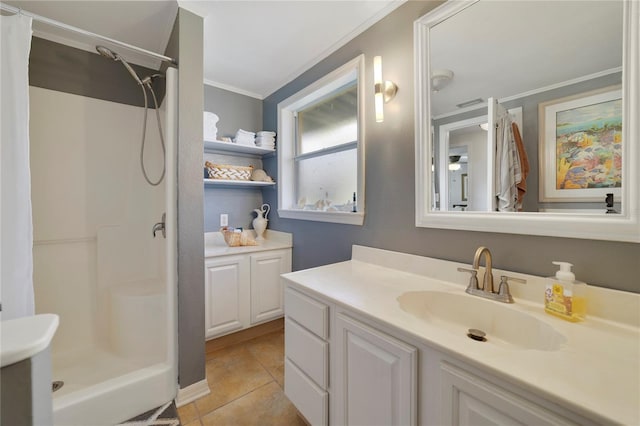 bathroom featuring vanity, tile patterned flooring, a shower with shower curtain, and ornamental molding