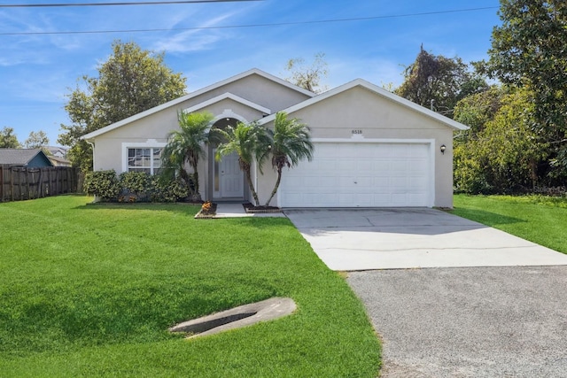 ranch-style house featuring a garage and a front yard