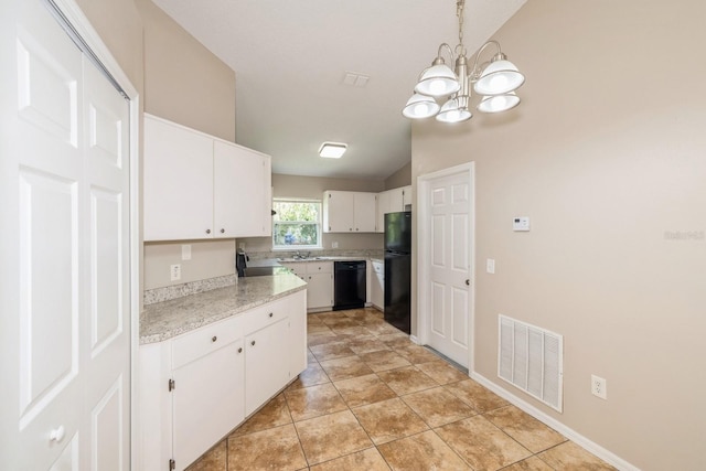 kitchen with an inviting chandelier, black appliances, light tile patterned floors, decorative light fixtures, and white cabinetry