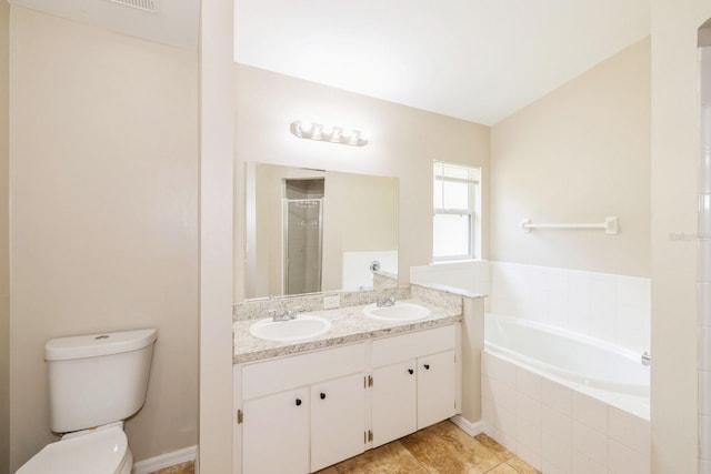 full bathroom with tile patterned flooring, vanity, shower with separate bathtub, and toilet