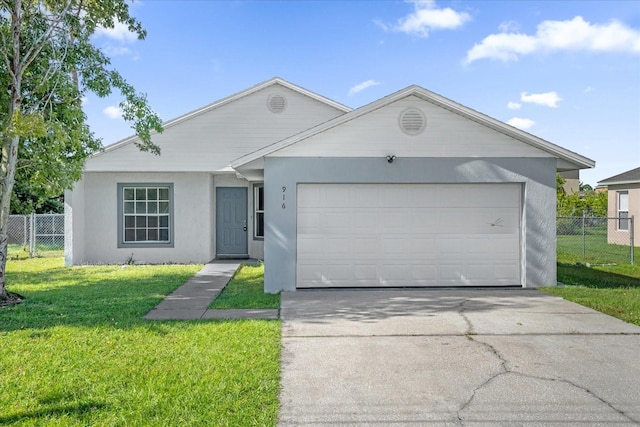 single story home with a front yard and a garage