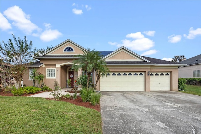 view of front facade featuring a garage and a front lawn