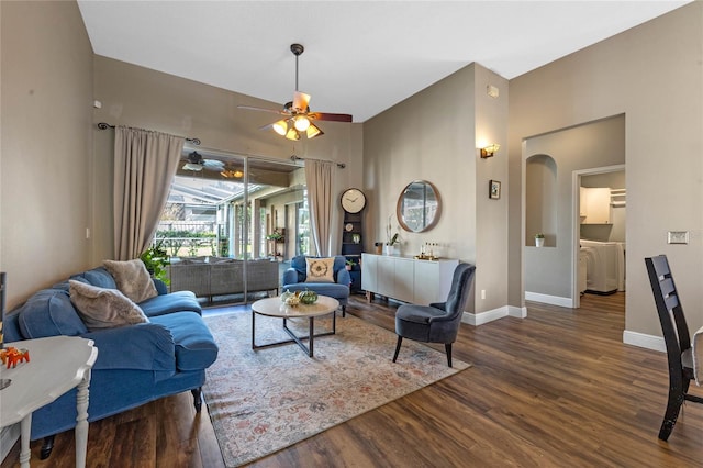 living room with dark hardwood / wood-style floors and ceiling fan