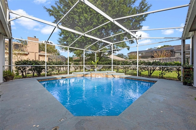 view of pool with a lanai and a patio area