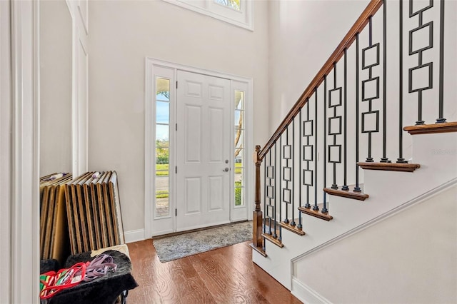 entryway with plenty of natural light and hardwood / wood-style flooring