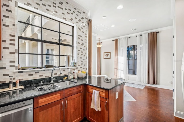 kitchen featuring dark hardwood / wood-style flooring, tasteful backsplash, stainless steel dishwasher, ornamental molding, and sink