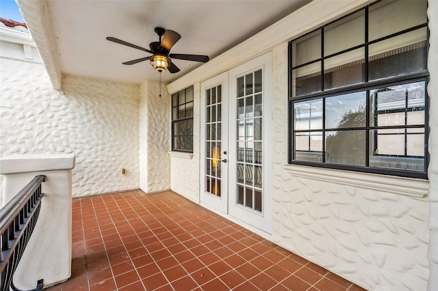 view of patio / terrace featuring ceiling fan and french doors