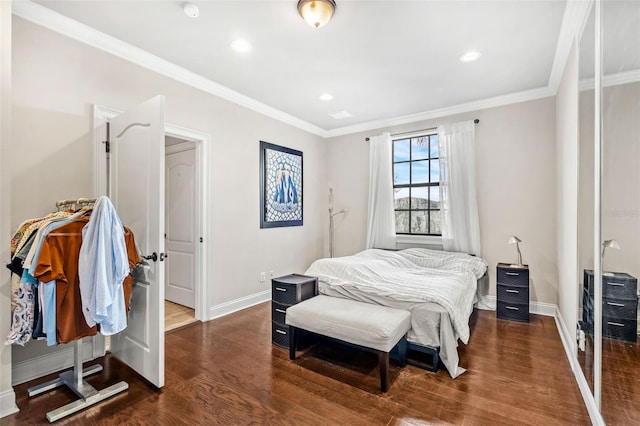 bedroom with crown molding and dark hardwood / wood-style flooring