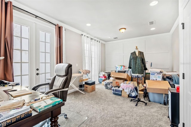 carpeted office with french doors and crown molding