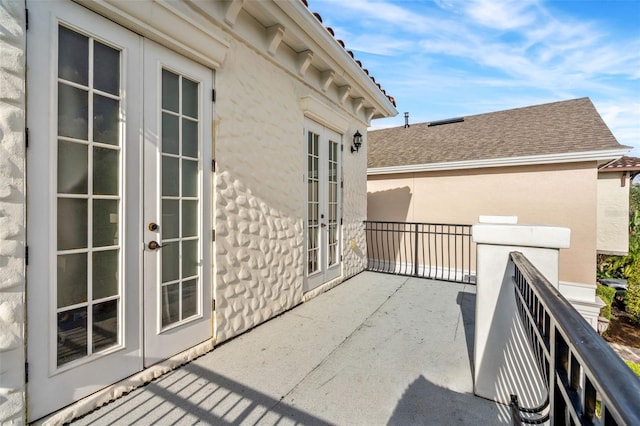 view of patio / terrace with french doors and a balcony