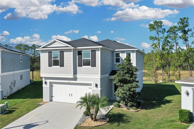 view of front of property with a garage and a front yard