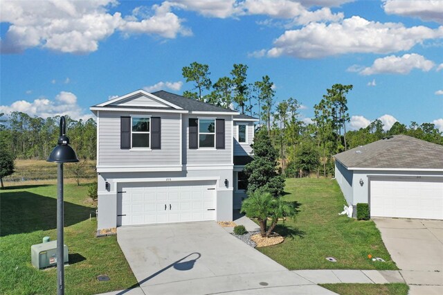 view of front of house featuring a garage and a front yard