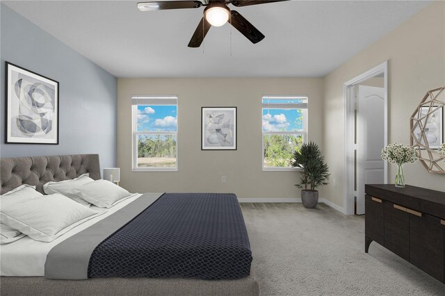 carpeted bedroom with ceiling fan