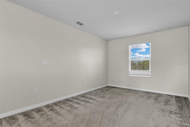 unfurnished room with carpet flooring