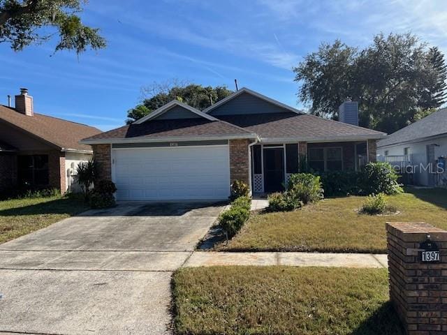 ranch-style home with a garage and a front yard