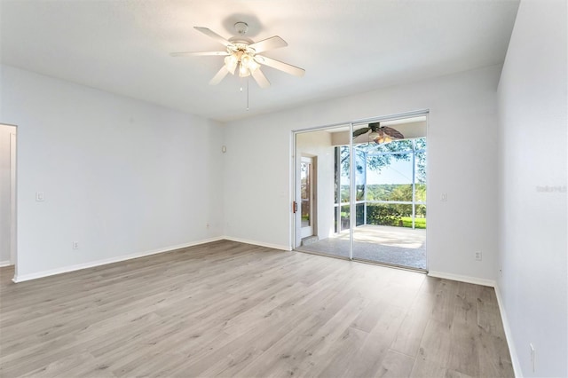 empty room with ceiling fan and light wood-type flooring