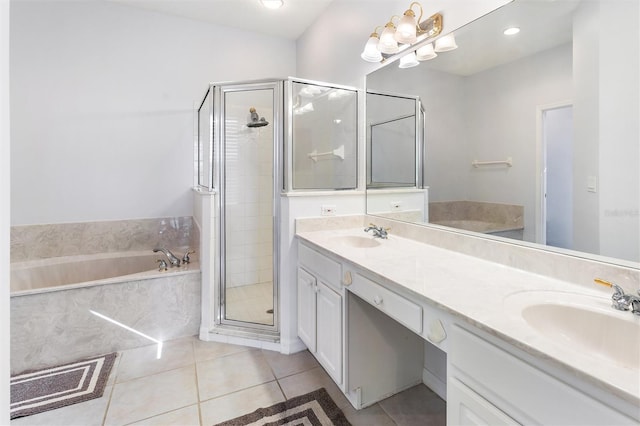 bathroom featuring tile patterned flooring, shower with separate bathtub, and vanity