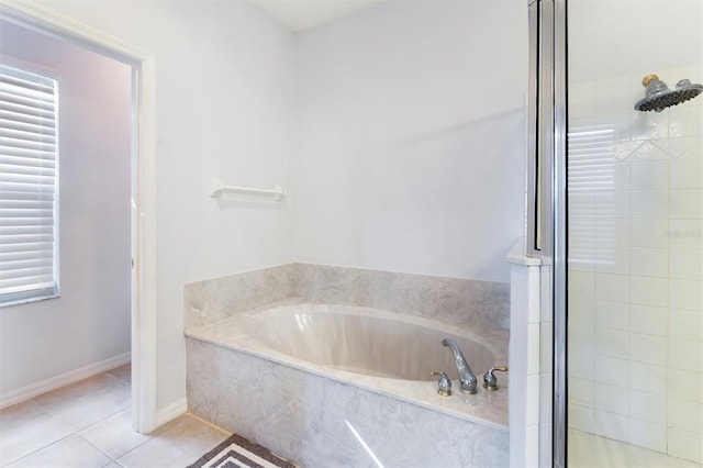 bathroom featuring separate shower and tub and tile patterned floors