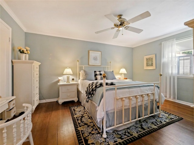 bedroom featuring ceiling fan, dark wood-type flooring, and ornamental molding