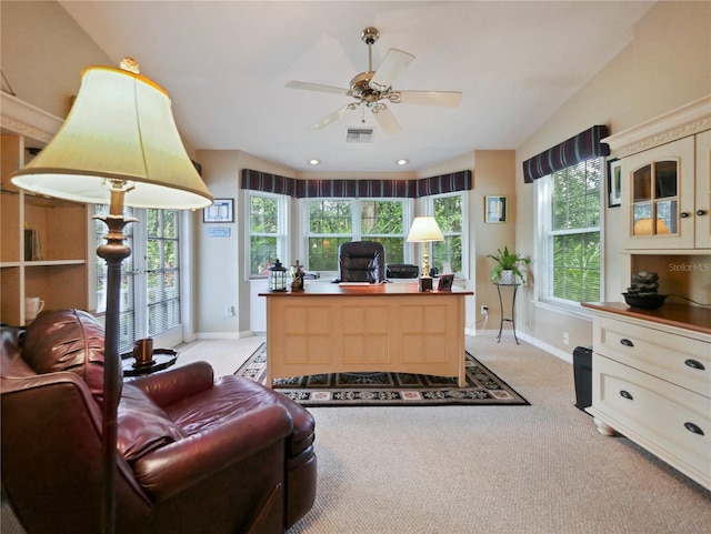 carpeted home office featuring vaulted ceiling and ceiling fan