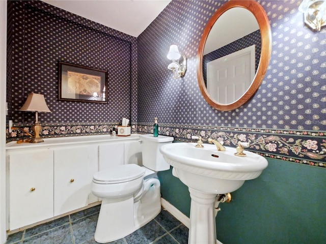 bathroom with tile patterned floors and toilet