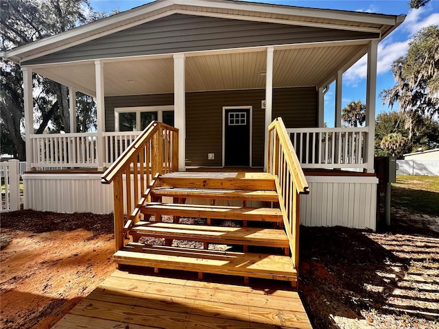 doorway to property with covered porch