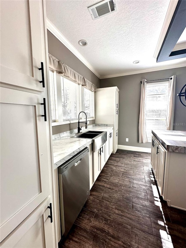 kitchen with dishwasher, dark hardwood / wood-style flooring, white cabinetry, and a healthy amount of sunlight