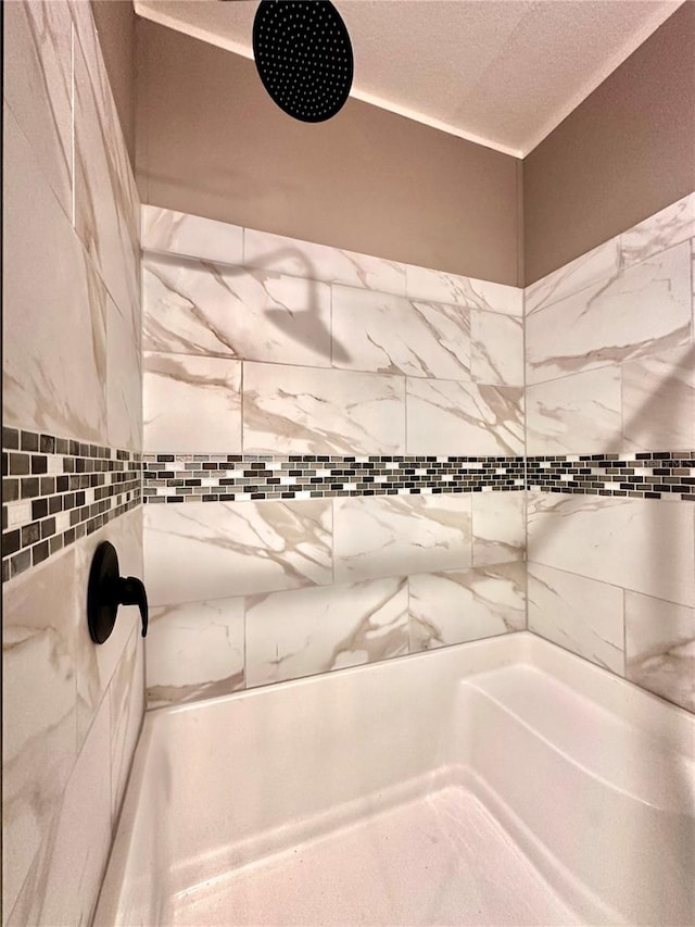 bathroom with a tile shower