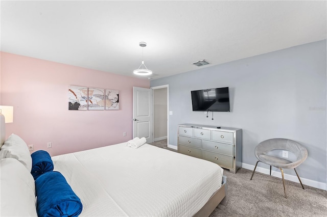 bedroom with light colored carpet