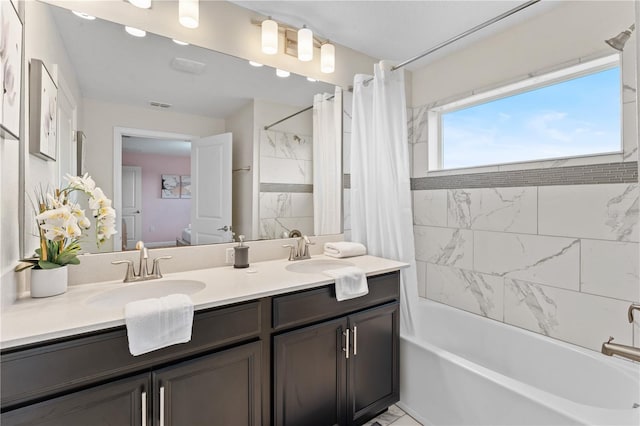 bathroom featuring vanity and shower / bath combo with shower curtain