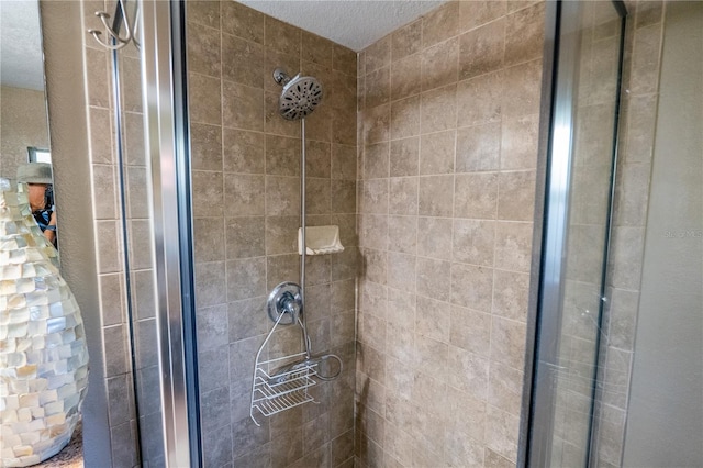 bathroom with a tile shower