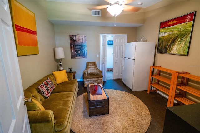 carpeted living room featuring ceiling fan