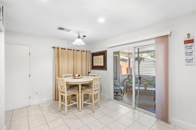 unfurnished dining area featuring light tile patterned flooring