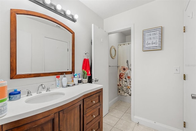 bathroom featuring tile patterned flooring and vanity