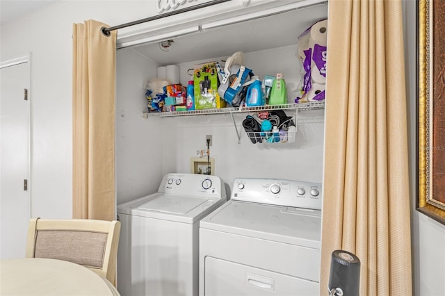 clothes washing area featuring washing machine and clothes dryer