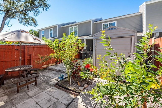 view of patio / terrace with a shed