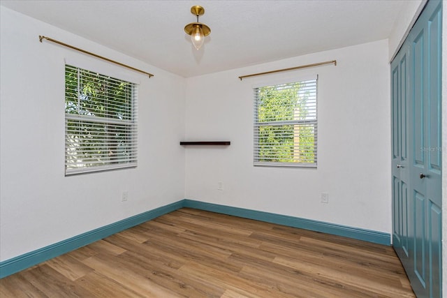 spare room featuring hardwood / wood-style flooring