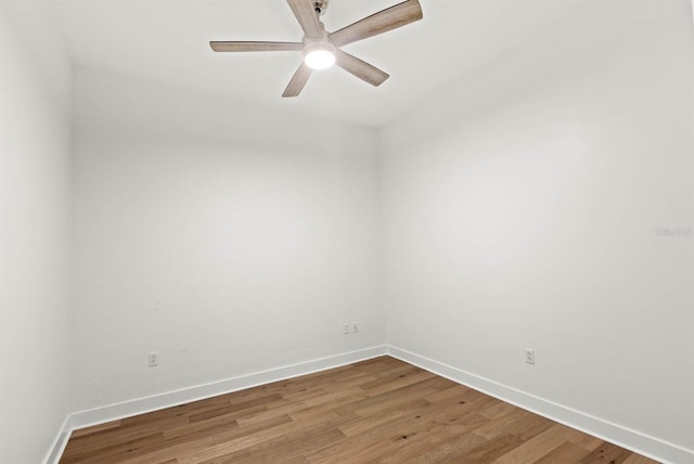 spare room with hardwood / wood-style flooring