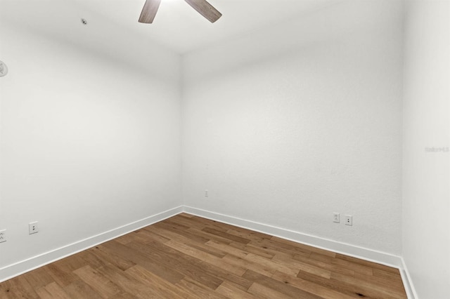 spare room featuring hardwood / wood-style flooring and ceiling fan