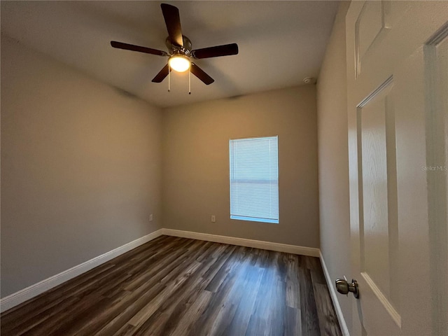 unfurnished room featuring dark hardwood / wood-style floors and ceiling fan