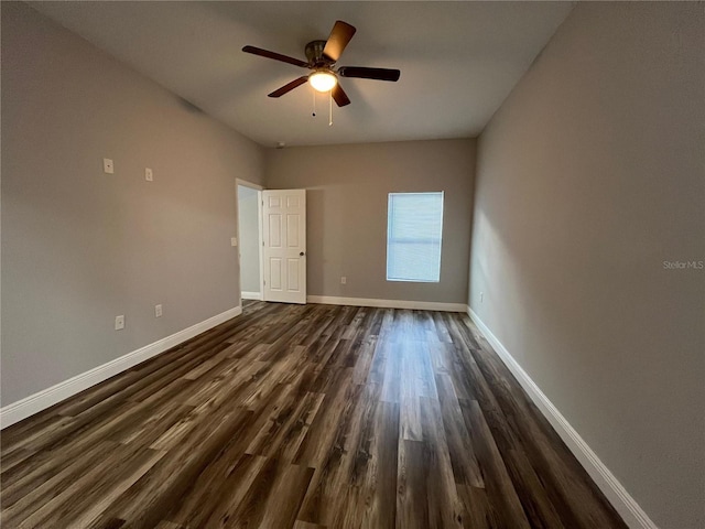 unfurnished bedroom with ceiling fan and dark hardwood / wood-style floors