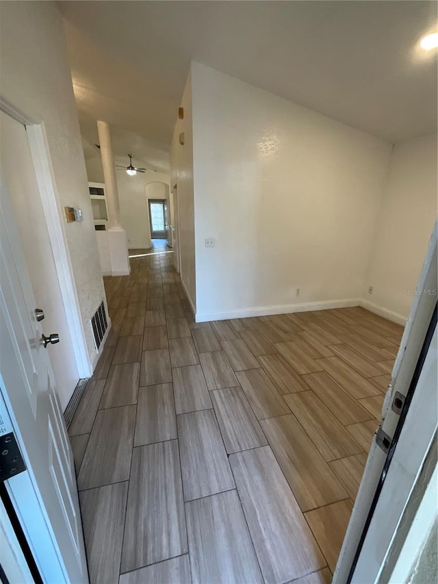 empty room featuring wood-type flooring and ceiling fan